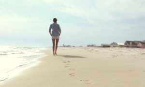 Lady Walking on Beach Barefoot